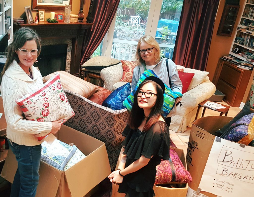 Here's Christine and June (with my daughter Qin) staking their claim on their fave "Bathtub Bargain" pillows. Note they are not crammed into my bathroom and have plenty of room to look at all the pillows.