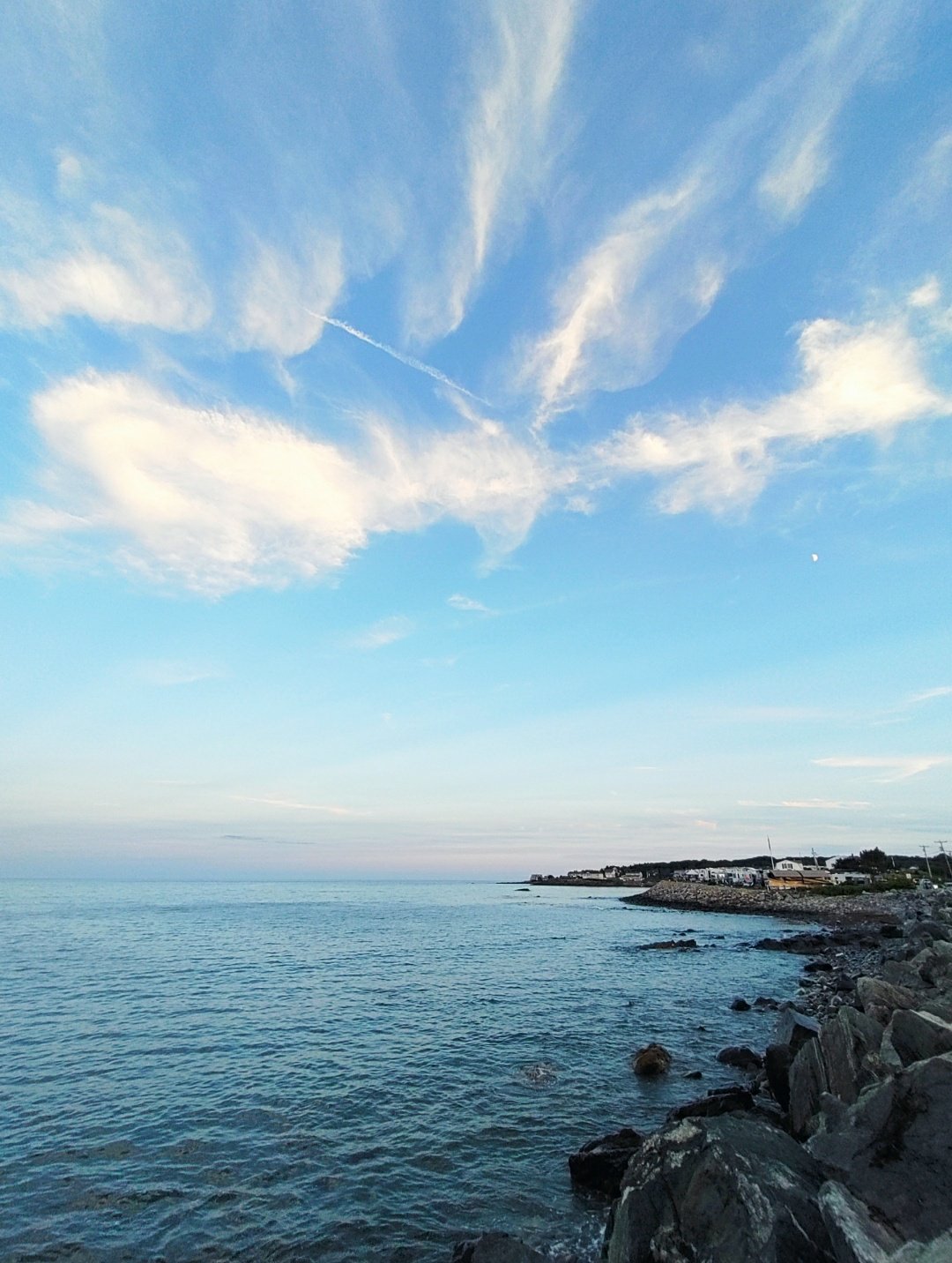 the sky and rocky coastline of York, Maine