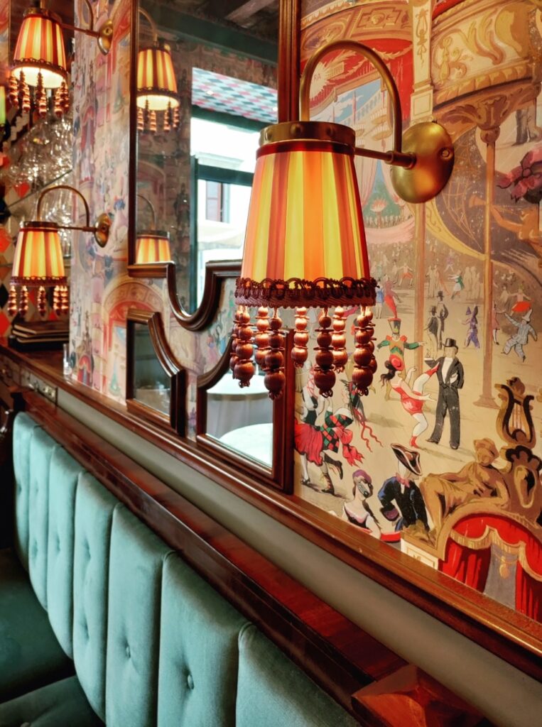 Lighting and wallpaper details designed by Mario Santini at Cafe Carducci