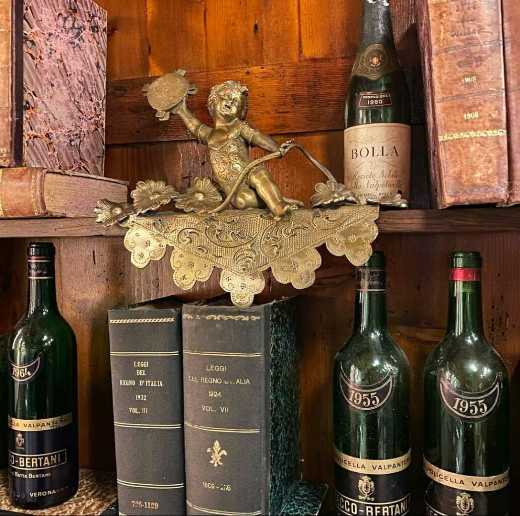 detail of books and wine at Cafe carducci, Verona, Italy.