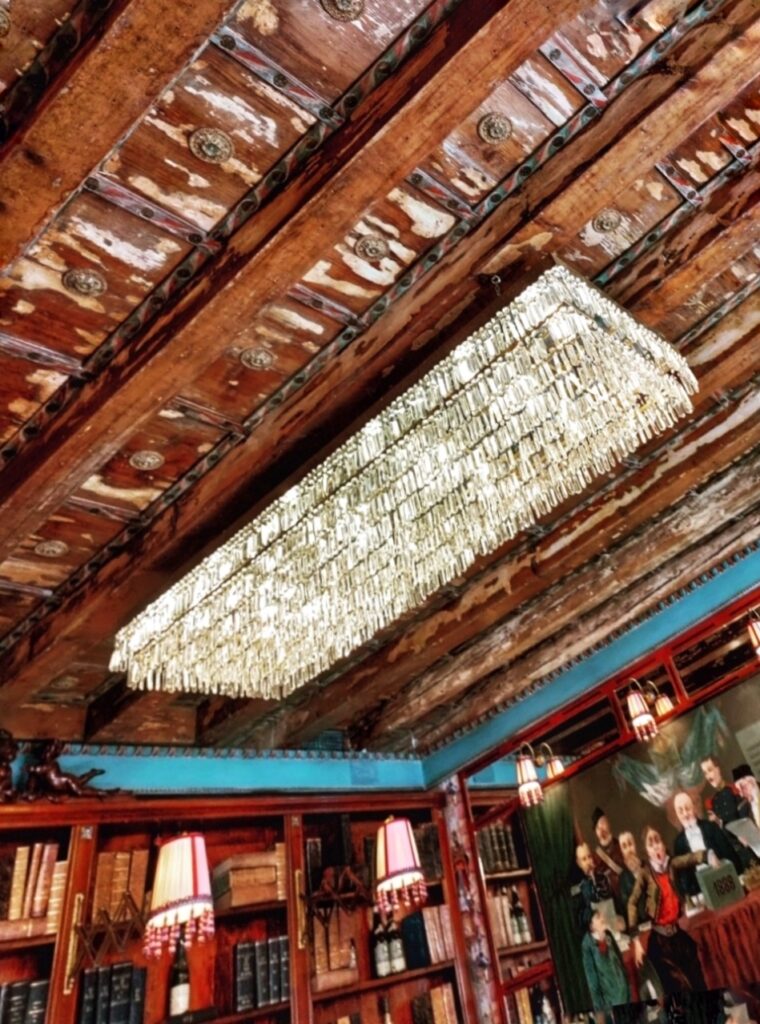 Rectangle Chandelier and old wooden beams at Cafe Carducci, Verona, Italy.